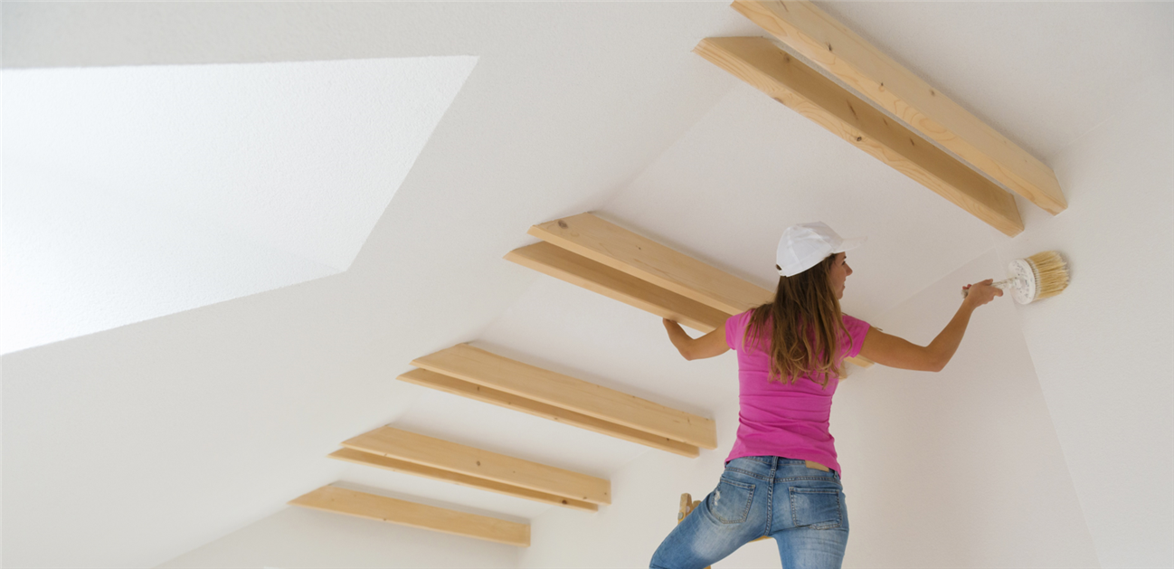 girl painting ceiling